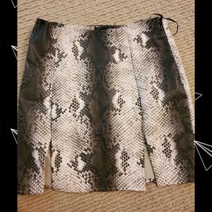 Mini form fitting snake pattern skirt